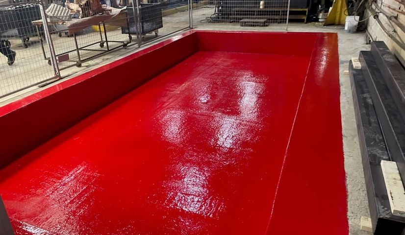 Red epoxy
            coating in containment tank