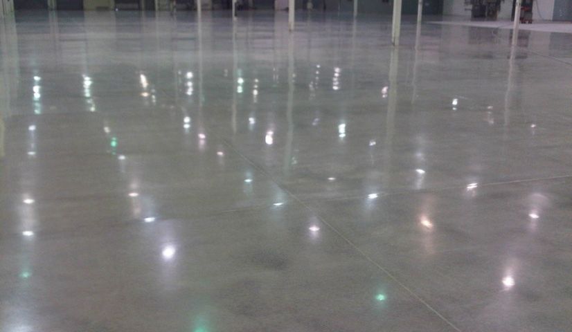 Empty
            warehouse with shiny polished concrete floors