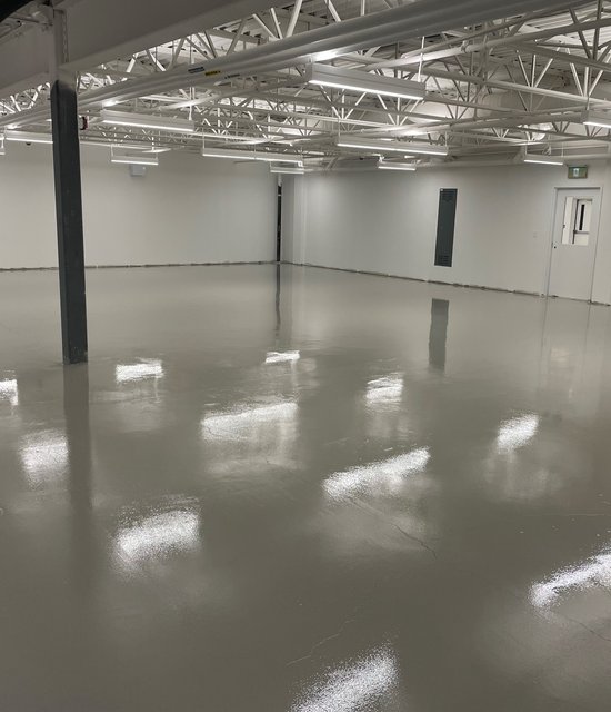 Industrial facility in Toronto cracked and dull green floors