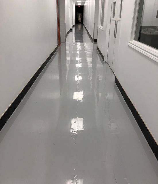 Commercial
            building Toronto after new gray epoxy flooring