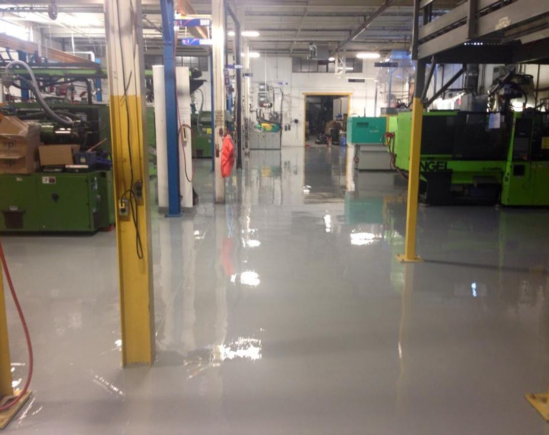 Manufacturing
        facility gray epoxy flooring