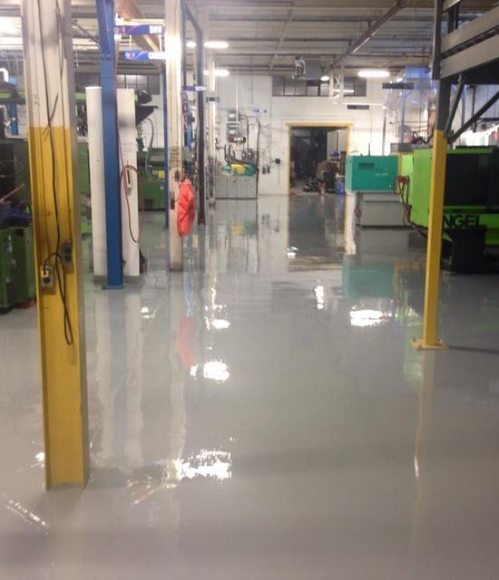 New gray epoxy
            flooring installed in Toronto industrial facility